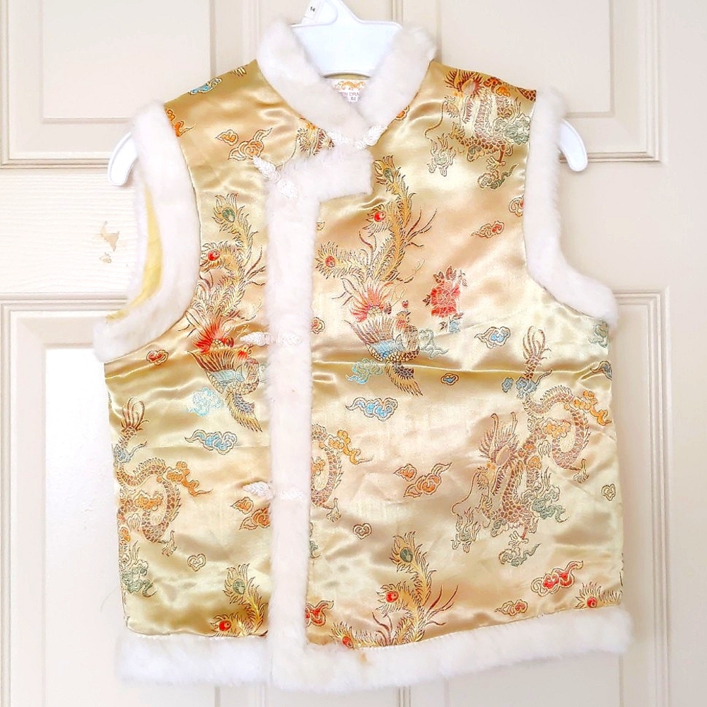 NWOT. Girl's quilted vest trimed with faux fur.
